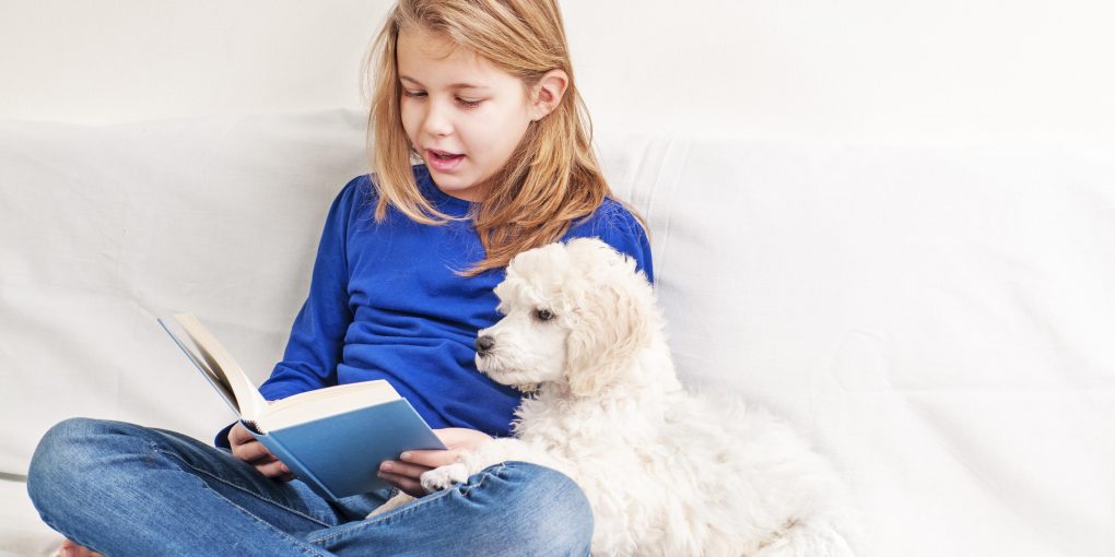 Kids read to dogs